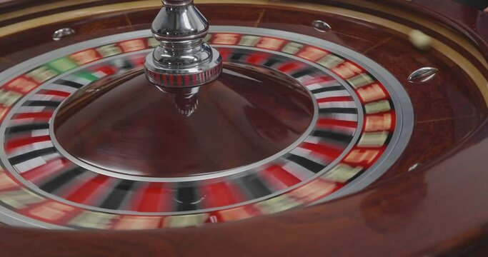 Spinning roulette in a casino. Croupier Spinning The Roulette Wheel. Spinning roulette in the casino close-up. Reletka close-up