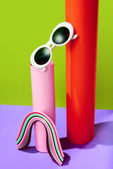 Poster. Real close up photo of trendy sunglasses on bright colorful background. Trendy Fashion summer accessories.