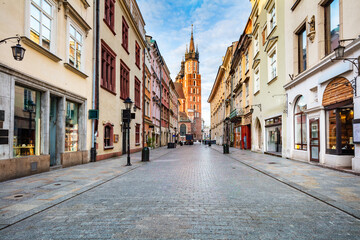 Old town street in Cracow, Poland with St. Mary's Basilica - obrazy, fototapety, plakaty