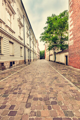 Empty cobblestone old town street in Cracow, Poland