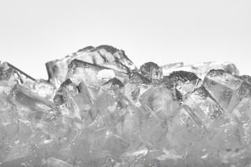 Sweet sugar crystals close up. White, transparent block.