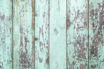 Vertical wooden desk peeling paint. Old peeling paint texture. Grunge cracked wall background. Blue color weathered surface. Broken wood structure. Vintage pattern design.
