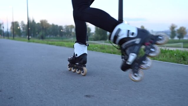 Close-up of a woman's legs roller skating. Slalom. 