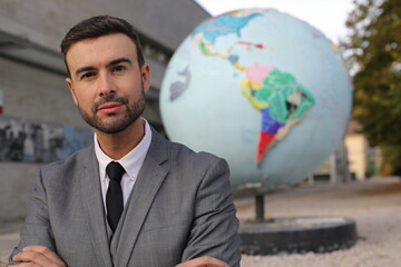 Businessman with the planet earth on the background 