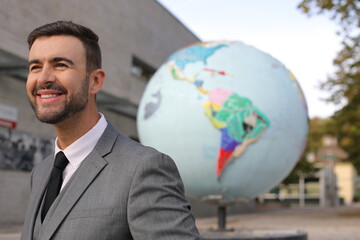 Businessman and a representation of the planet earth in the background 