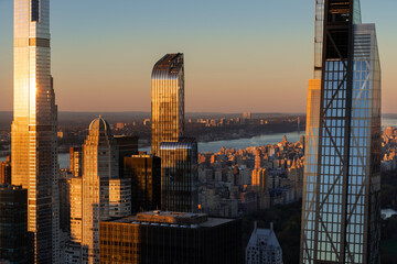 New York City aerial view of supertall skyscrapers of Billionaires' Row at sunset. Midtown Manhattan