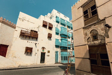 Fototapeta na wymiar Traditional architecture of old Jeddah town El Balad district houses with wooden windows and balconies Unesco Heritage site in Jeddah Saudi Arabia