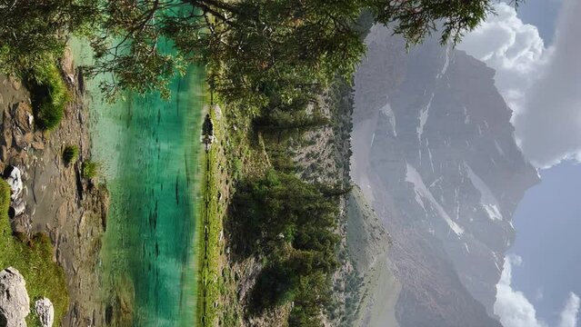 The Alaudin (Chapdara) lakes, lying at an altitude of 2800 m, are considered one of the most beautiful lakes of the Fan Mountains. Turquoise mountain lake. Pamiro-Alai. Tajikistan, Pamir 4K