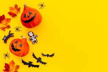 Festive Halloween decoration with pumpkin head and black bats