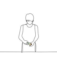 man stands peeling potatoes with a vegetable peeler - one line art vector. concept peeling potatoes for cooking