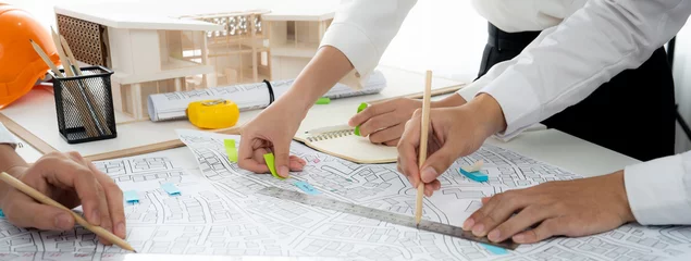 Fotobehang Worker, architect and engineer work on real estate construction project oratory planning with cartography and cadastral map of urban town area to guide to construction developer business plan of city © Summit Art Creations