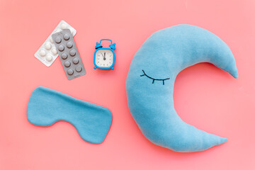 Sleeping pills and moon pillow for good night. Insomnia concept