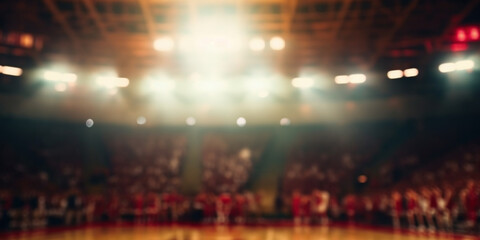 A defocused indoor stadium with floodlights and fans. Abstract blurred sports background.