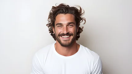 Foto op Canvas Man in his 30s with long curly hair and a white t - shirt  © Kiss