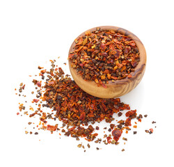 Pepper flakes spice in wooden bowl isolated on white background