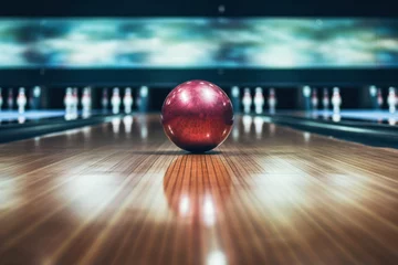 Fotobehang Purple bowling ball on the lane with blurred background of pins. © NikonLamp