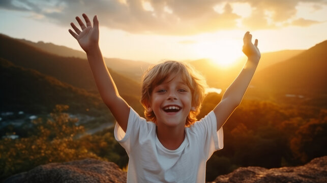 Boy kid wearing a white t-shirt joyfully raises his arms, his vibrant energy shining against a captivating nature landscape at sunset , portraying an aura of positivity and exuberance