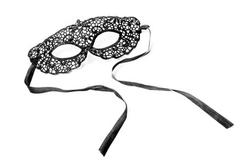 black lace mask with ribbons on a white background