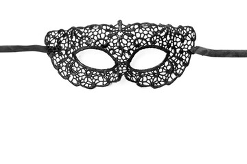 black lace mask with ribbons on a white background
