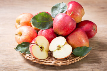 fresh red apples on wooden table