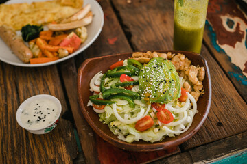 Bowl of greens with chicken