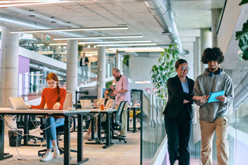 In a modern startup office, a diverse group of young professionals collaboratively tackles various business problems and challenges, surrounded by their engaged colleagues, fostering innovation and