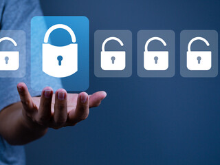 Access security cyber and privacy, Businessman showing padlock that locks technology security...