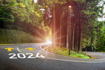 2024 future ahead and arrow marking on highway road and white marking lines. Inspiration and...