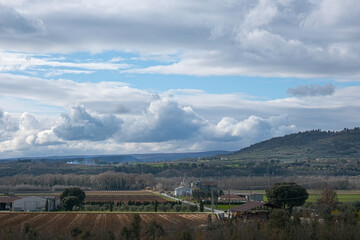 Obraz premium Rural landscape with hills and wheat fields