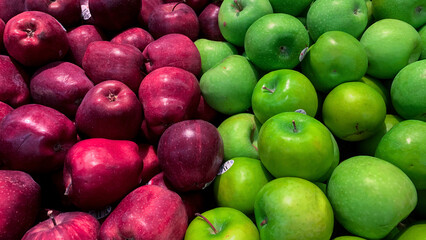 red and green apples ready to sell at the traditional market
