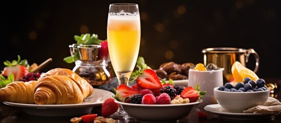 Close up of table with brunch dishes and glass of champagne Selective focus With copyspace for text