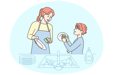 Smiling kid helping mom with dishes