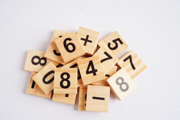 Number wood block cubes for learning Mathematic, education math concept.