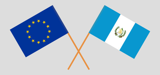 Crossed flags of the European Union and Guatemala. Official colors. Correct proportion