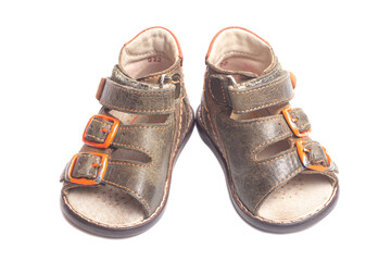 Children's leather sandals isolated on a white background.