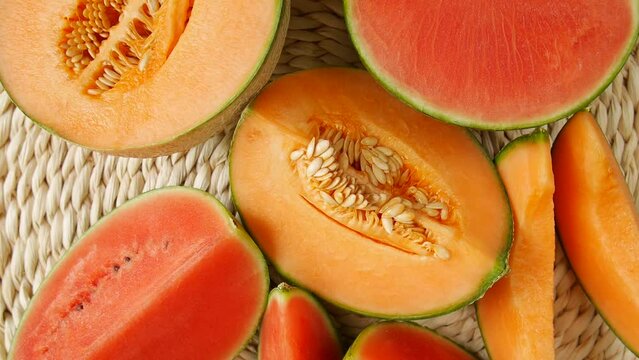 Cut melon watermelon on the table.