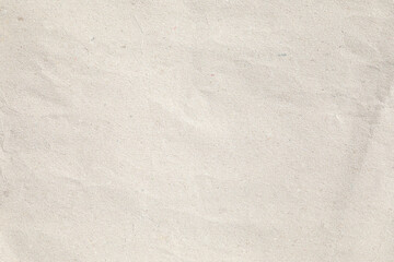 Fototapeta premium Brown crumpled paper texture with grains macro closeup