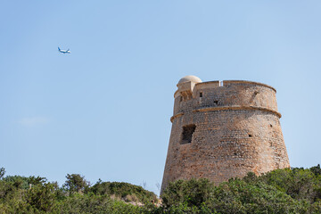 Beautiful view of the old observation tower off the coast of the island of Ibiza.