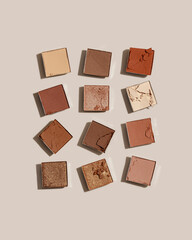 Natural color eye shadow makeup palette, crushed face powder swatches. Woman cosmetic and beauty product, aesthetic cosmetics still life beauty photography, beige color eyeshade pattern, above view