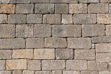 Architecture textures, detailed view of a traditional paired granite masonry, used on a ancient walls