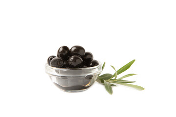 Tasty black olives isolated on white background. Olive and olive tree branches on a white table. Delicacy.