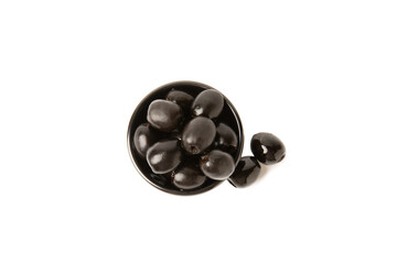 Tasty black olives isolated on white background. Olive and olive tree branches on a white table. Delicacy.