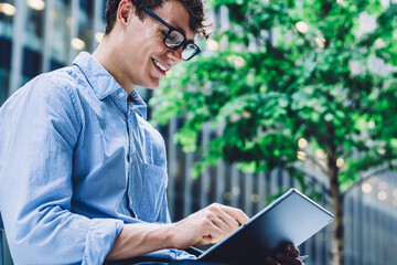  happy smiling businessman in optical spectacles enjoying free time for messaging