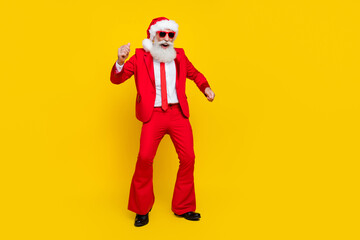 Fototapeta na wymiar Full length photo of cheerful funky claus wear red tux costume having fun dancing disco empty space isolated yellow color background