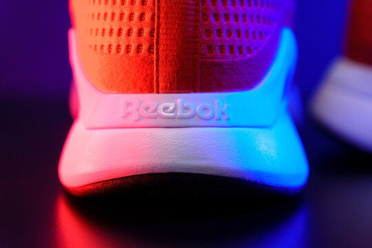 Tyumen, Russia-August 03, 2023: Reebok red sneakers logo. Reebok is a global athletic footwear and apparel company.