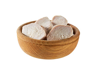 Pieces of boiled chicken fillet in a wooden bowl isolated on white background.
