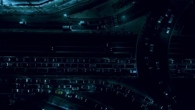 Financial technology, energy power, beautiful top view time-lapse of car traffic at roundabout lane and buildings. 4K drone aerial zoom out. Urban cityscape concept or abstract of advanced innovation.