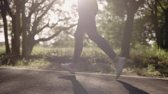 4k resolution slow motion Asian female woman doing workout stretching, jogging and running on summer at a city park,health care and sportive concept.