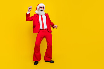 Fototapeta na wymiar Full length photo of cheerful positive man enjoy dancing clubbing occasion isolated on yellow color background