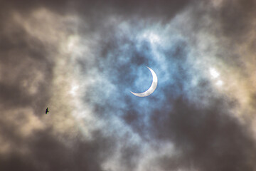 Obraz na płótnie Canvas moon in clouds eclipse with sun